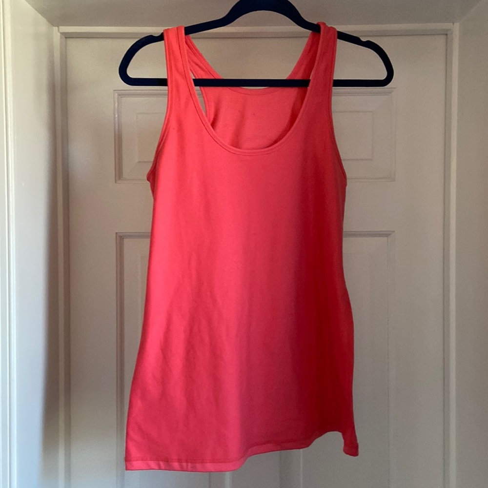 Cute tank top with Pure Barre emblem on the back.